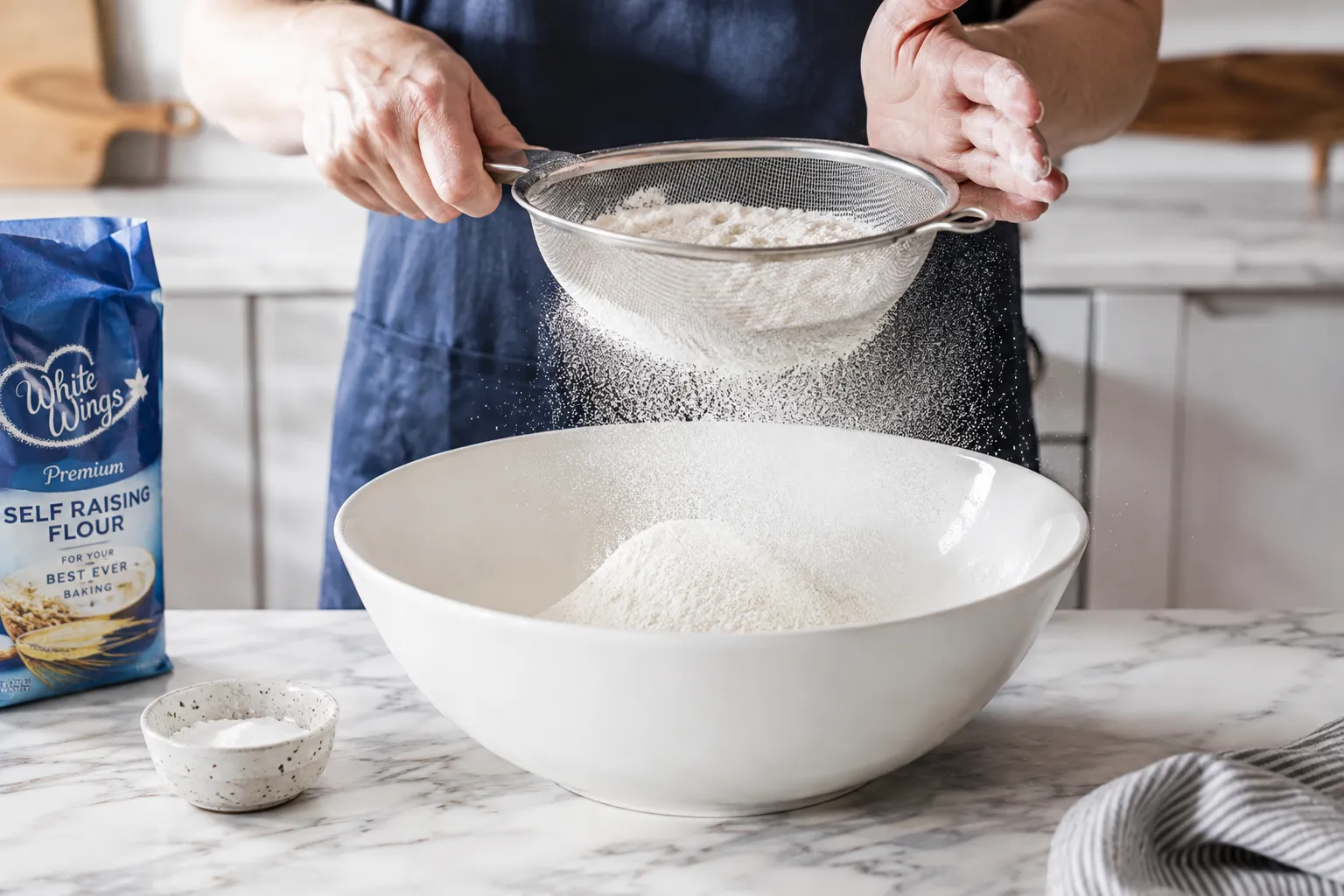 Sifting flour into bowl